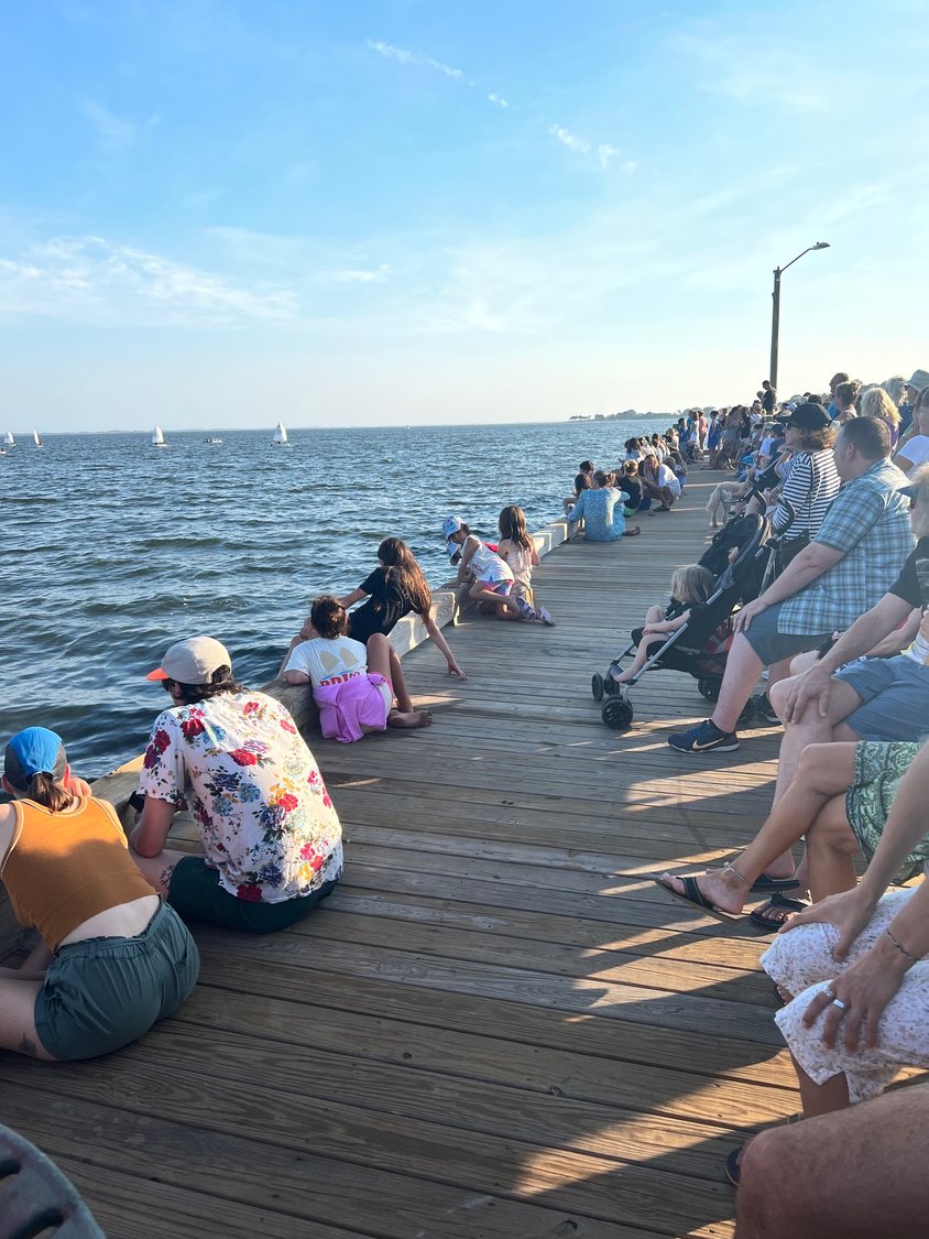 Hundreds of spectators came out to cheer on the competitors and to enjoy the warm, sunny day with a cool breeze ideal for smooth sailing and relaxing.